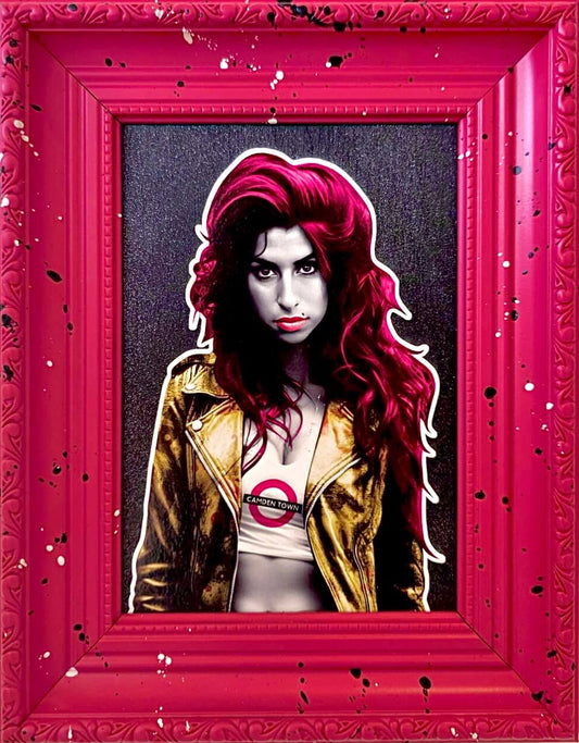 Amy Winehouse artwork by The Postman with red hair and gold jacket against a dark background in a pink frame